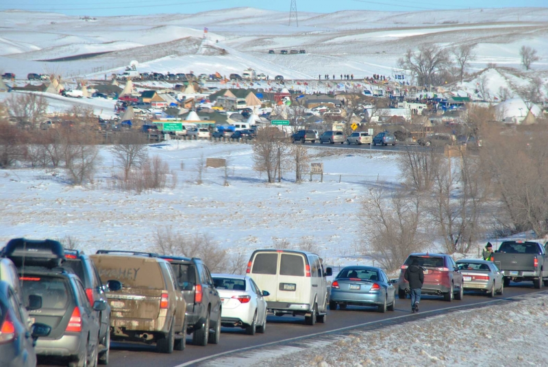 Carvan to Standing Rock, from early morning until late night, the thousands of vehicles streetched for more than a mile - photo by C.S. Hagen