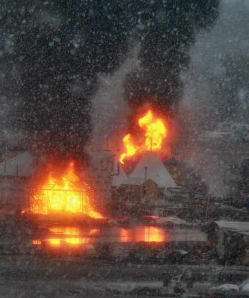 First structures set ablaze at the Oceti camps February 22 - photo by C.S. Hagen