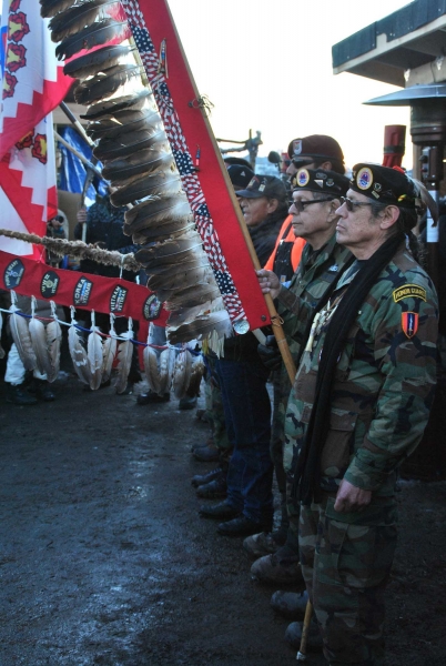 Veterans for Standing Rock before sacred fire - photo by C.S. Hagen